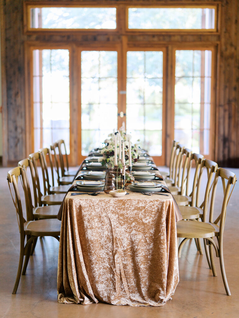 romantic southern wedding tablescape at The Adelphia with lush florals, soft candlelight, and elegant rentals styled by Simply Bliss Events.