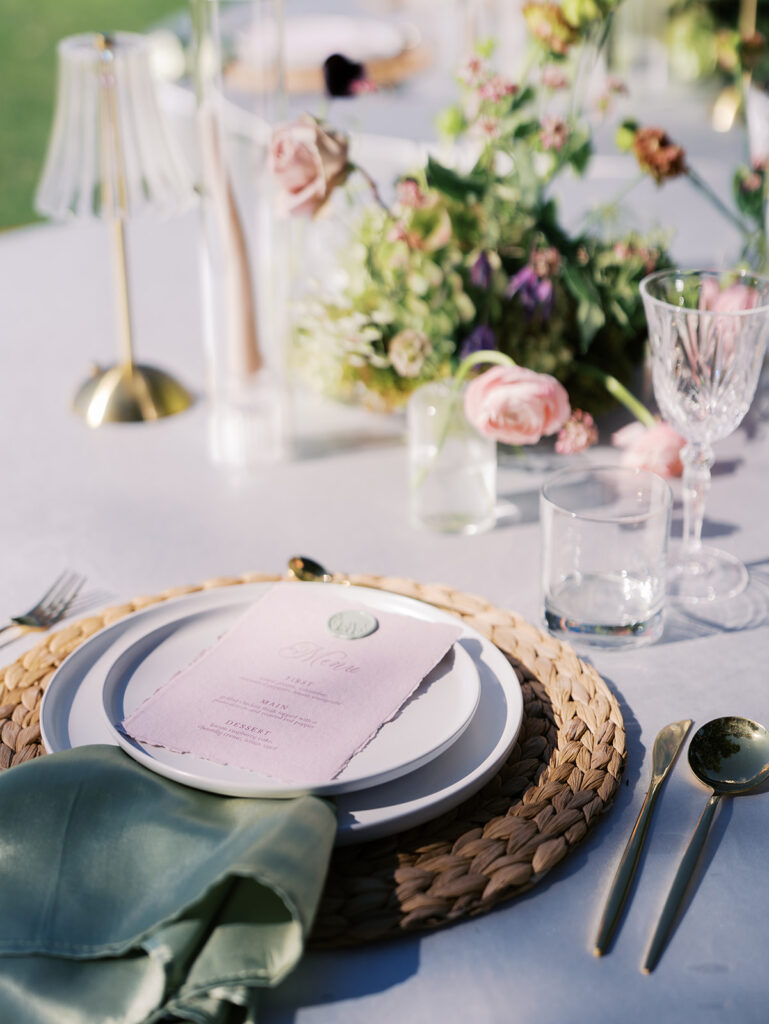 romantic southern wedding tablescape at The Adelphia with lush florals, soft candlelight, and elegant rentals styled by Simply Bliss Events.