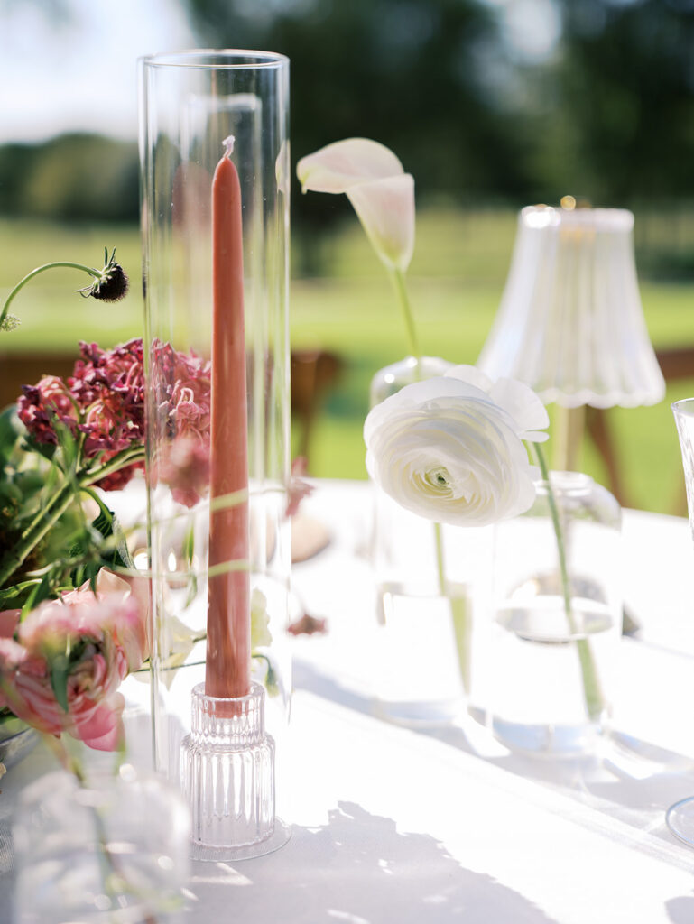 romantic southern wedding tablescape at The Adelphia with lush florals, soft candlelight, and elegant rentals styled by Simply Bliss Events.
