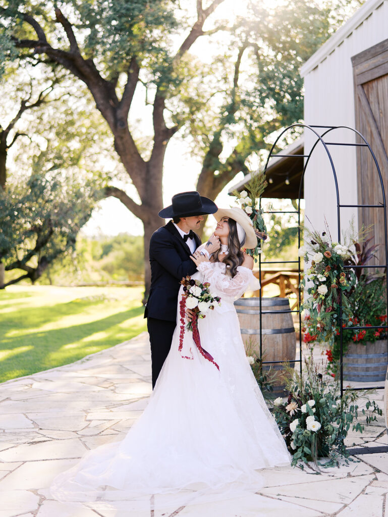 Bride and groom at The Adelphia wedding editorial in Lampasas, TX, surrounded by romantic florals and southern charm