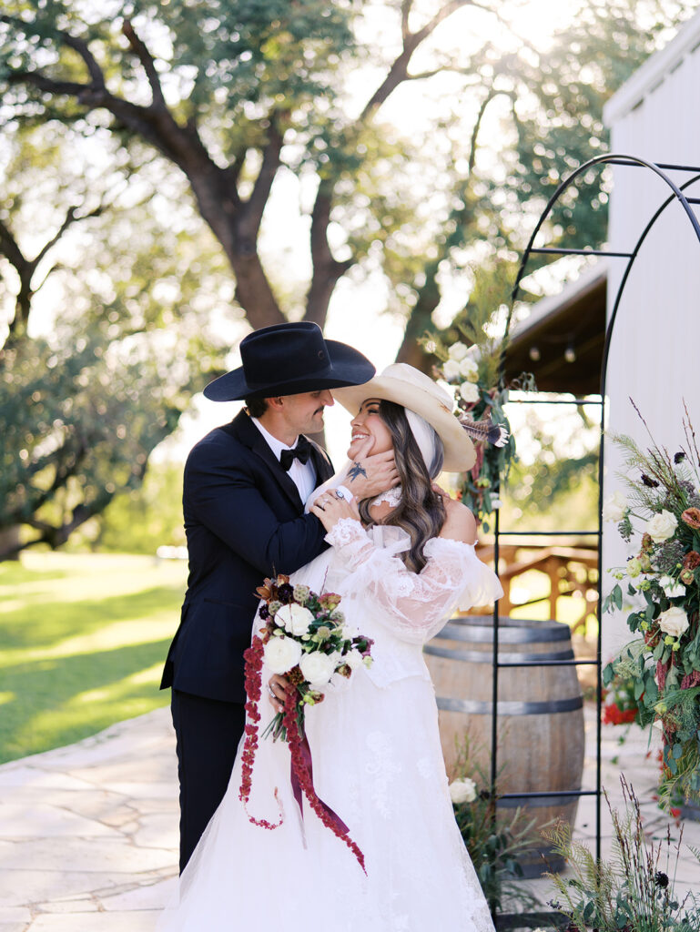 Bride and groom at The Adelphia wedding editorial in Lampasas, TX, surrounded by romantic florals and southern charm
