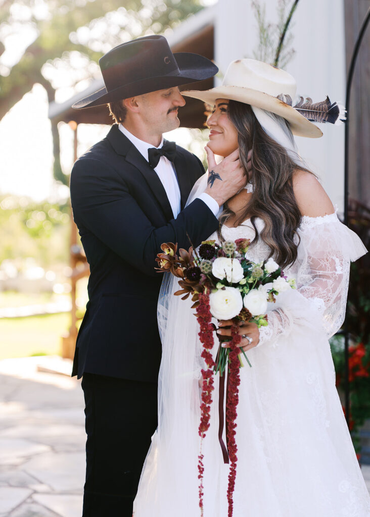 Bride and groom at The Adelphia wedding editorial in Lampasas, TX, surrounded by romantic florals and southern charm.
