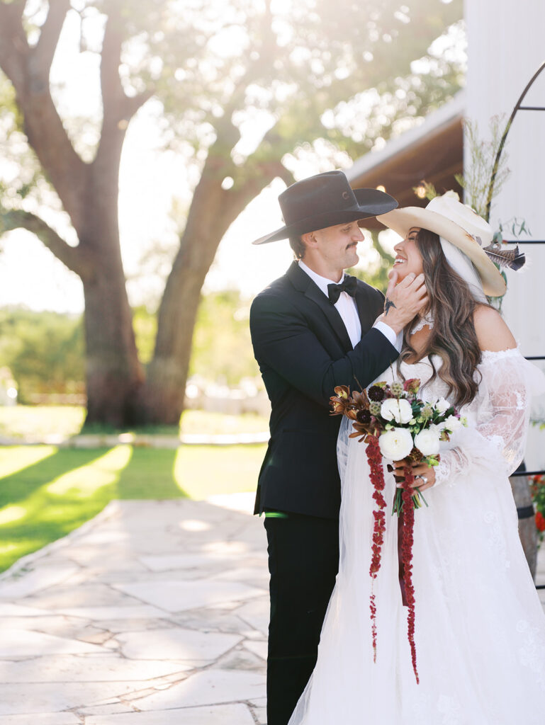 Bride and groom at The Adelphia wedding editorial in Lampasas, TX, surrounded by romantic florals and southern charm.