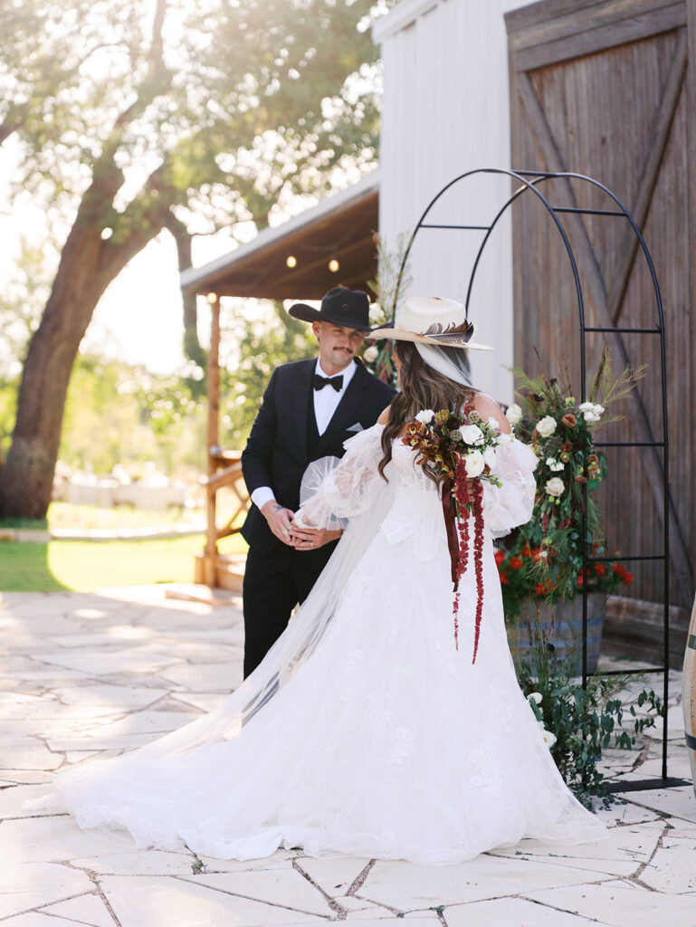 Bride and groom at The Adelphia wedding editorial in Lampasas, TX, surrounded by romantic florals and southern charm.