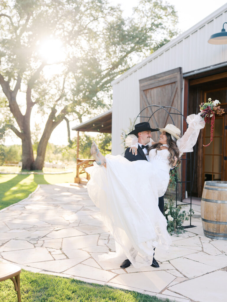 Bride and groom at The Adelphia wedding editorial in Lampasas, TX, surrounded by romantic florals and southern charm.