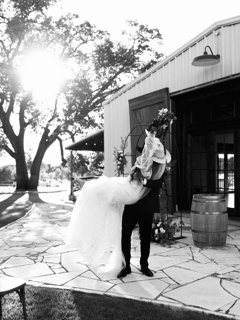 Bride and groom at The Adelphia wedding editorial in Lampasas, TX, surrounded by romantic florals and southern charm