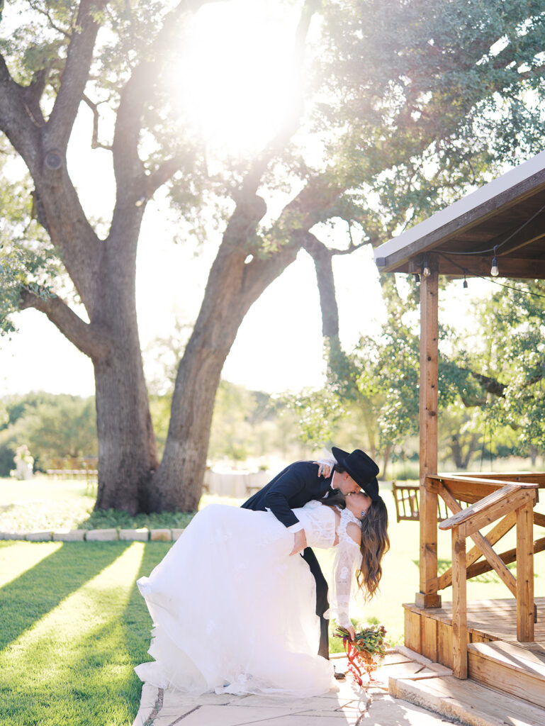 Bride and groom at The Adelphia wedding editorial in Lampasas, TX, surrounded by romantic florals and southern charm.