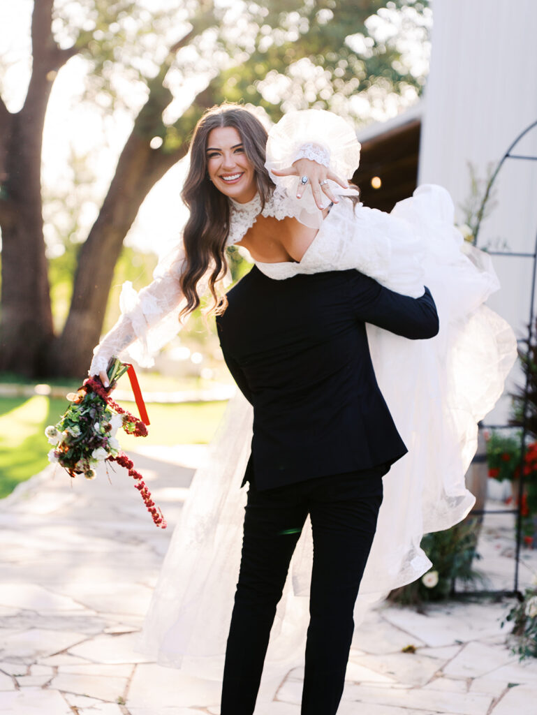 Bride and groom at The Adelphia wedding editorial in Lampasas, TX, surrounded by romantic florals and southern charm.
