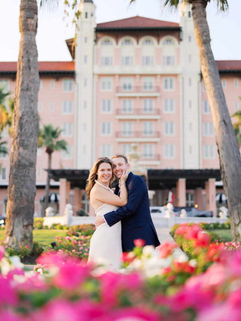 Emma twirling under palm trees while Luke smiles with vibrant timeless color captured on film