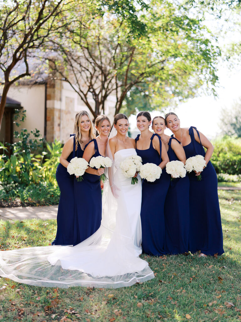 Joyful wedding portraits surrounded by greenery and warm Texas light