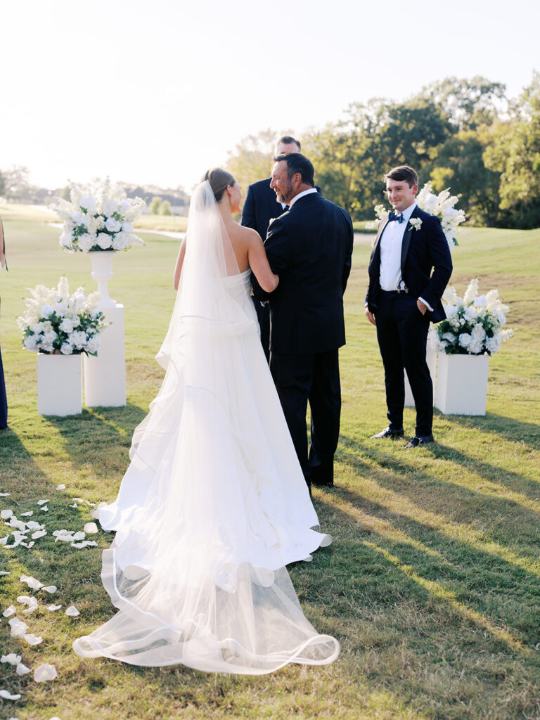 Elegant Texas wedding ceremony surrounded by family and friends