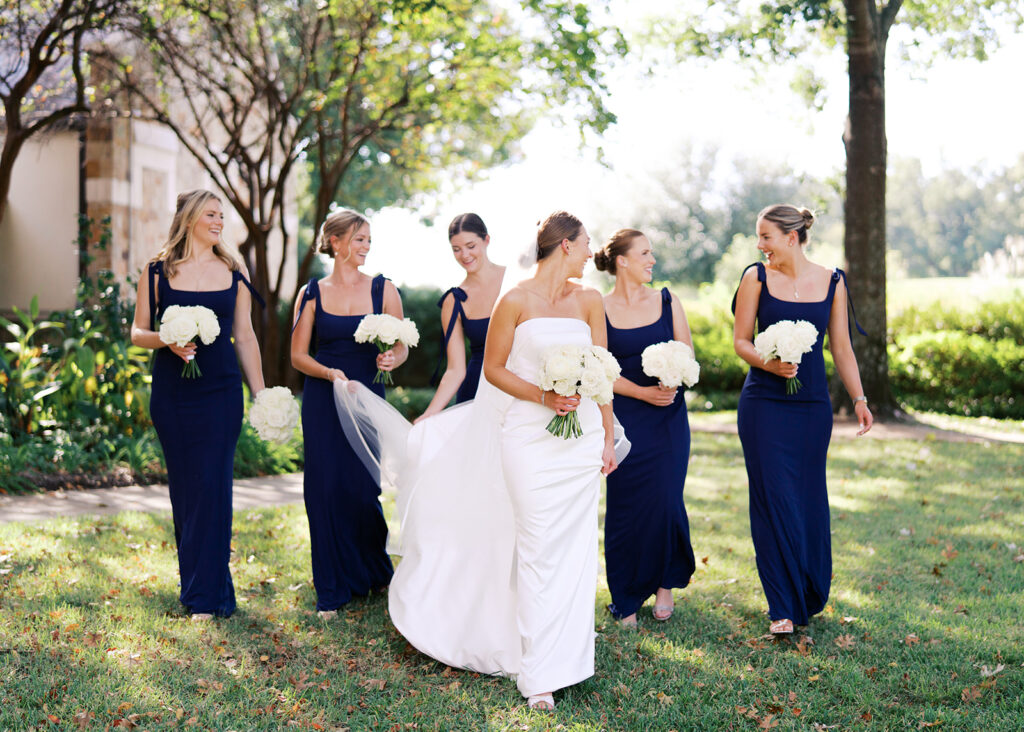 Joyful wedding portraits surrounded by greenery and warm Texas light