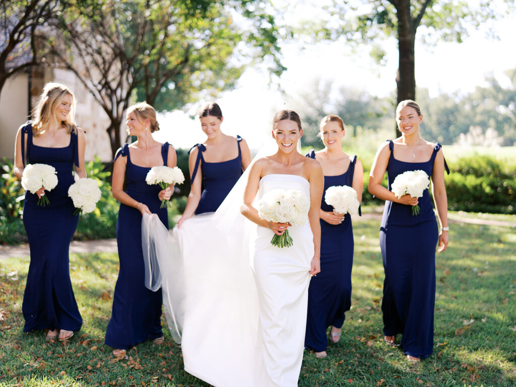 Joyful wedding portraits surrounded by greenery and warm Texas light