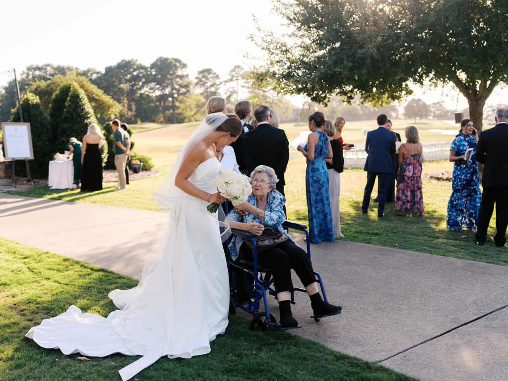 Candid moments during cocktail hour at Texas country club wedding