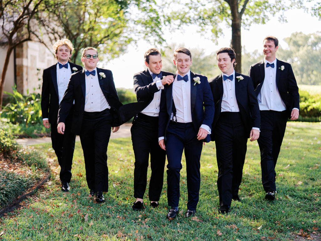 Joyful wedding portraits surrounded by greenery and warm Texas light