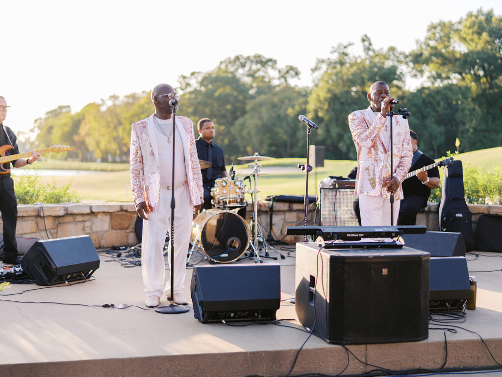 Candid moments during cocktail hour at Texas country club wedding