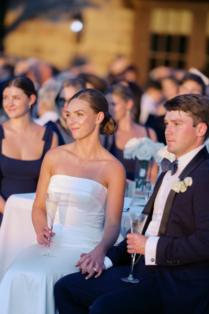 Elegant Texas wedding reception with candlelit tables and dancing guests