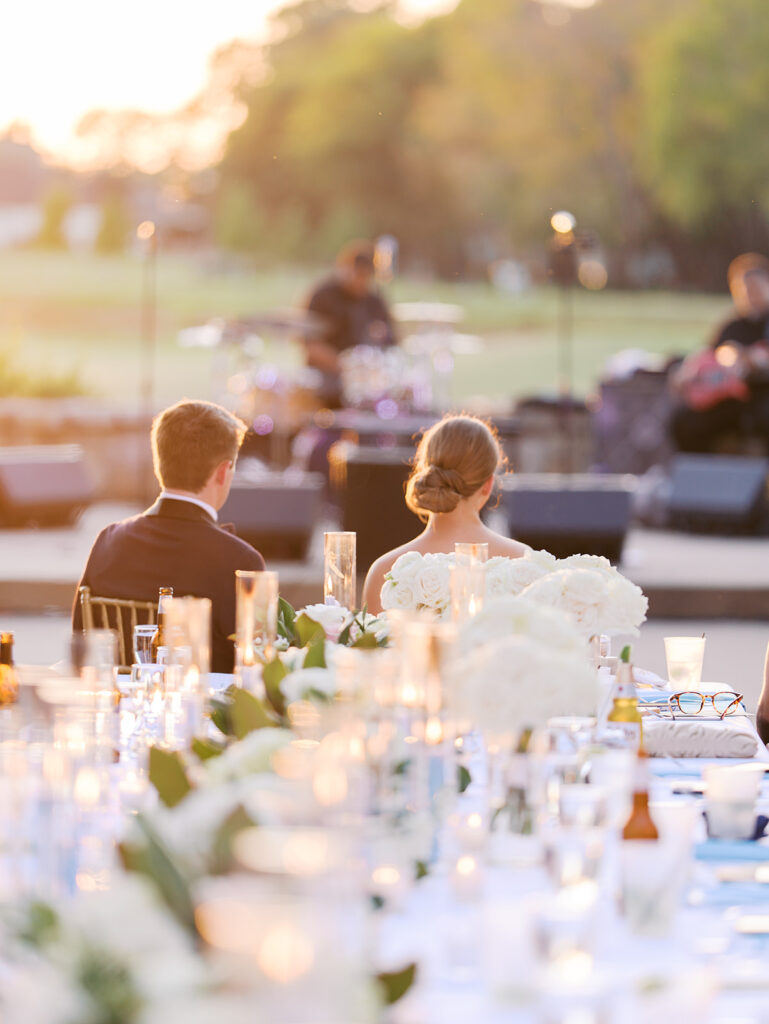 Elegant Texas wedding reception with candlelit tables and dancing guests
