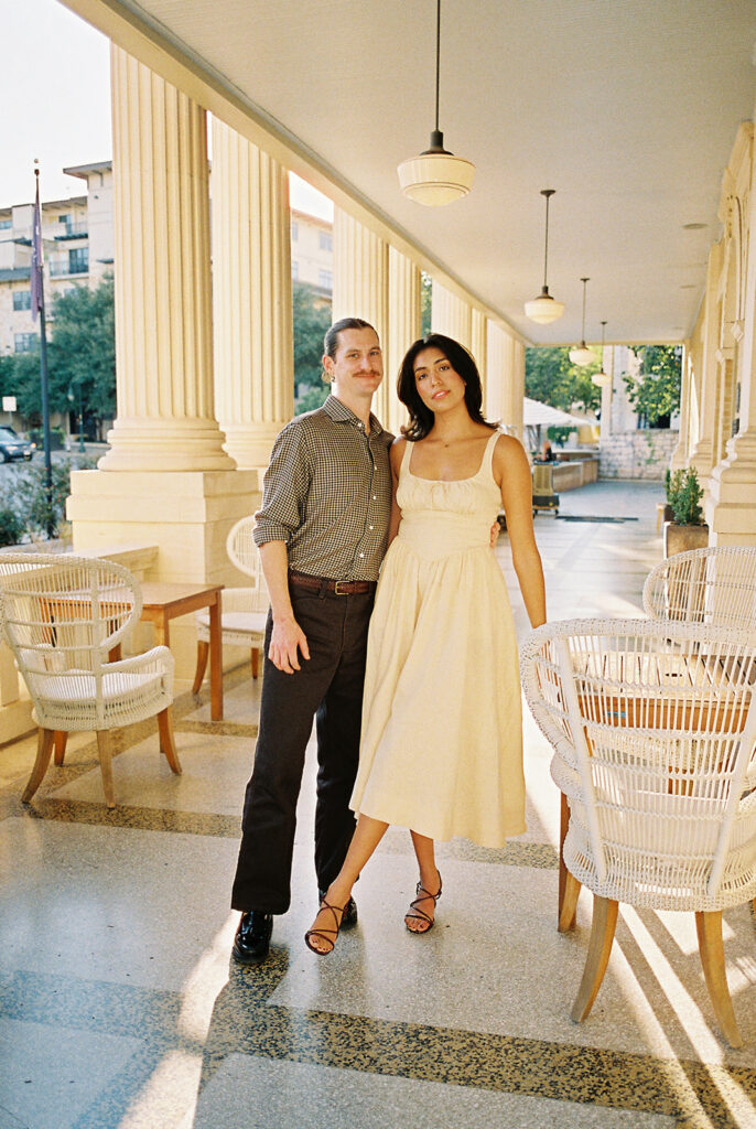 Hotel Ella columns and courtyard used as engagement photo backdrop in Austin