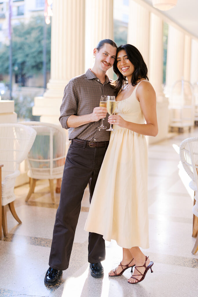 Hotel Ella columns and courtyard used as engagement photo backdrop in Austin