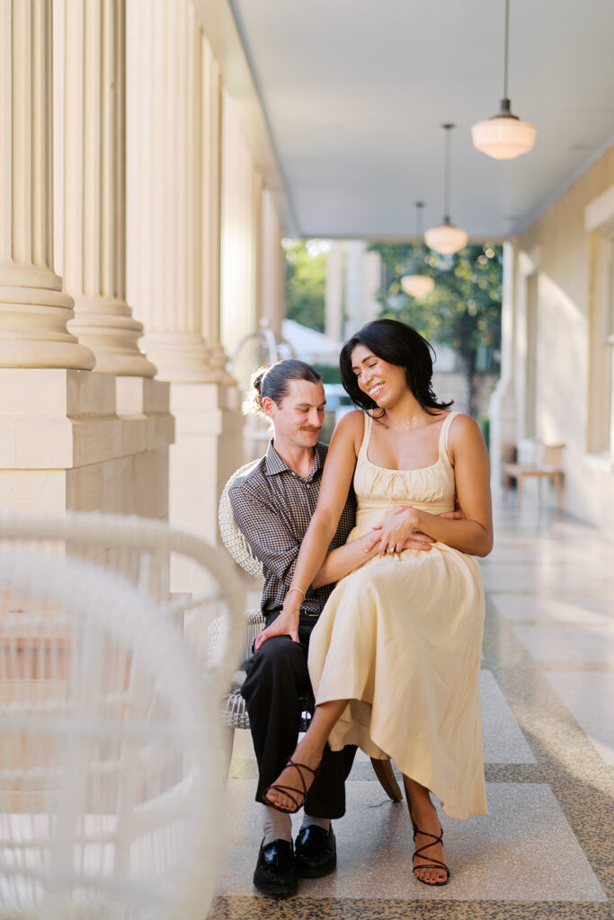 Hotel Ella columns and courtyard used as engagement photo backdrop in Austin