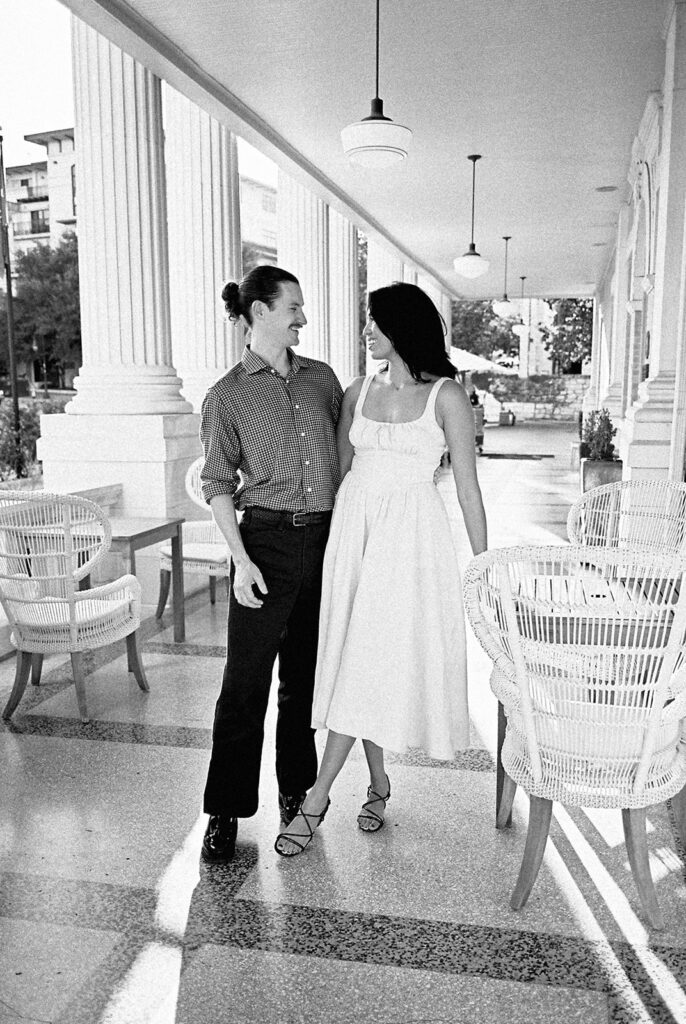 Hotel Ella columns and courtyard used as engagement photo backdrop in Austin