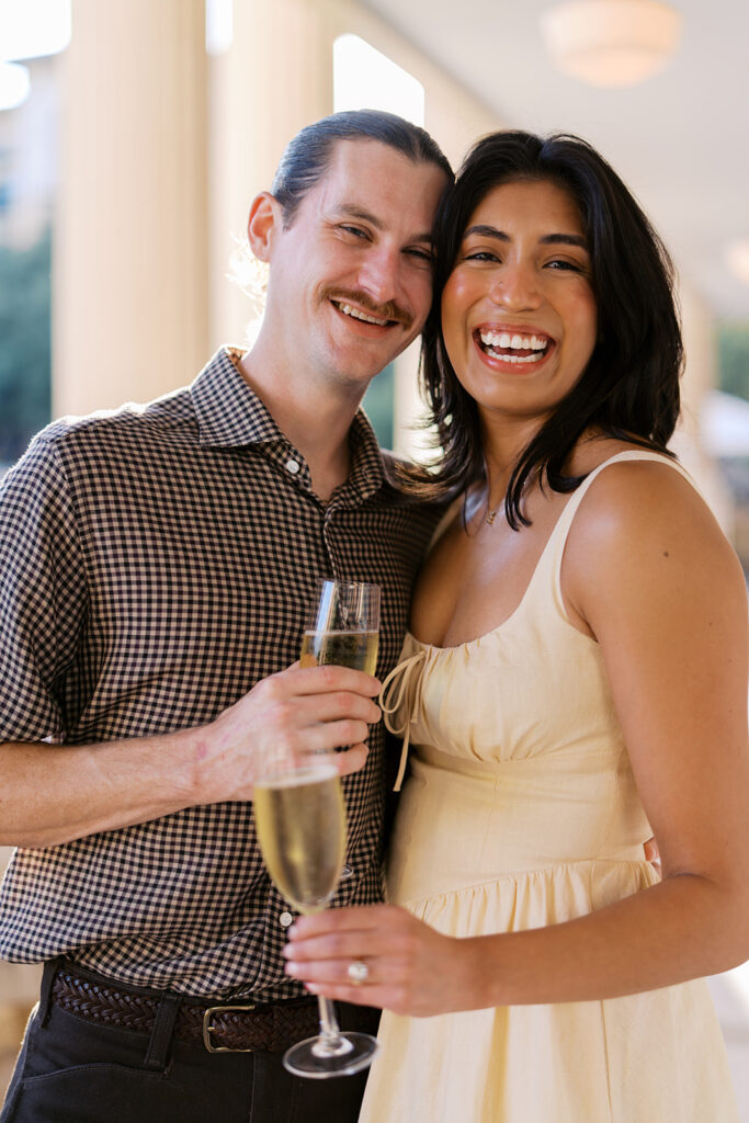 Hotel Ella columns and courtyard used as engagement photo backdrop in Austin