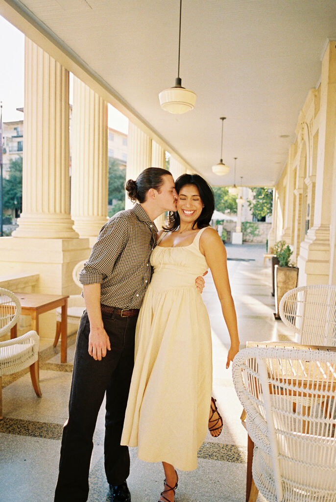 Hotel Ella columns and courtyard used as engagement photo backdrop in Austin