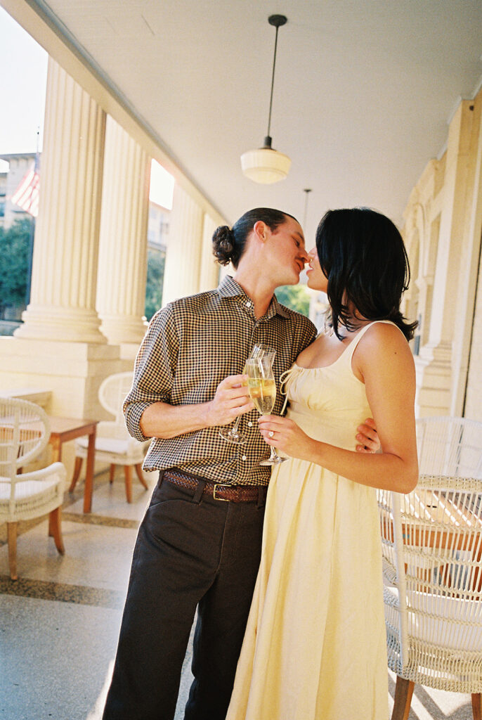 Hotel Ella columns and courtyard used as engagement photo backdrop in Austin
