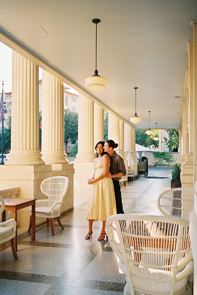 Hotel Ella columns and courtyard used as engagement photo backdrop in Austin