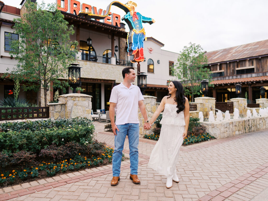 Playful couple laughing together during Fort Worth engagement photos