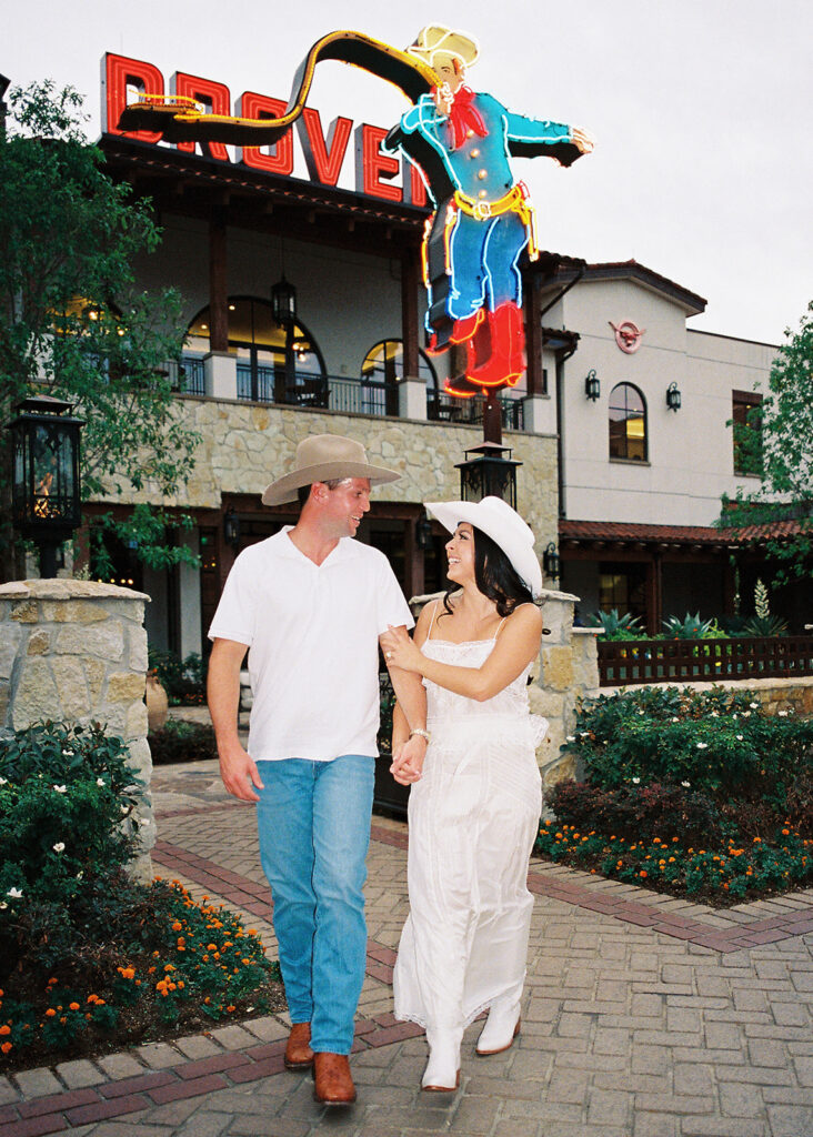Playful couple laughing together during Fort Worth engagement photos