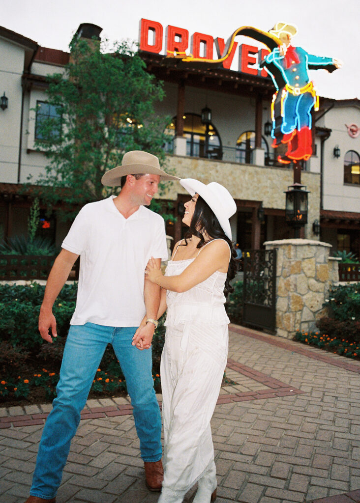 Playful couple laughing together during Fort Worth engagement photos