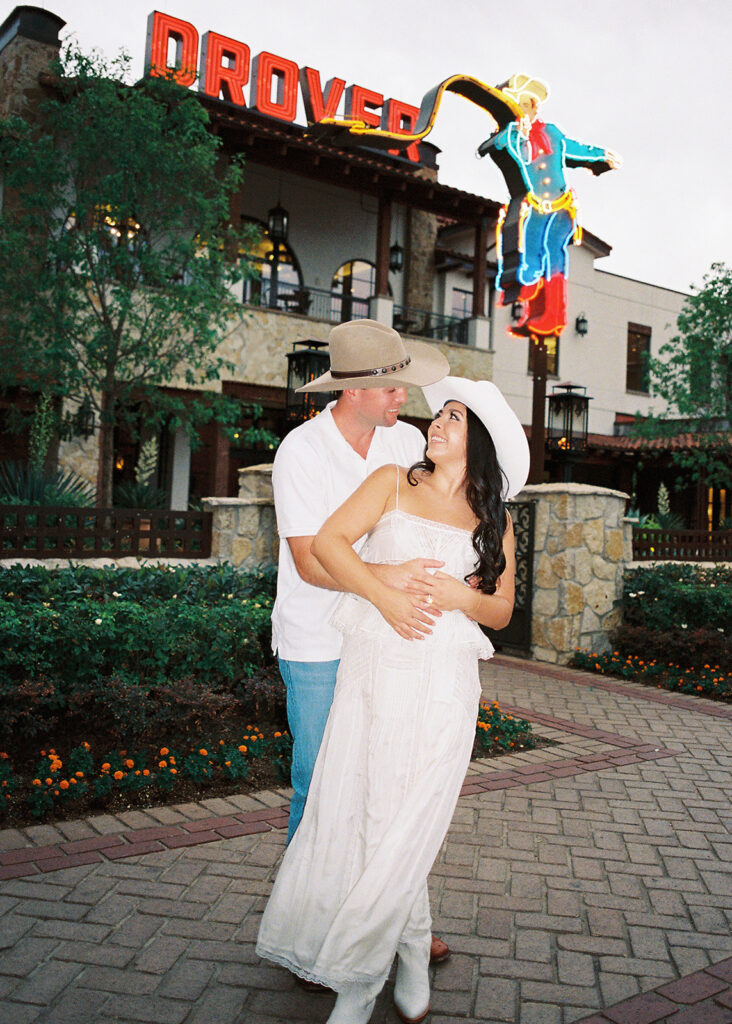 Playful couple laughing together during Fort Worth engagement photos
