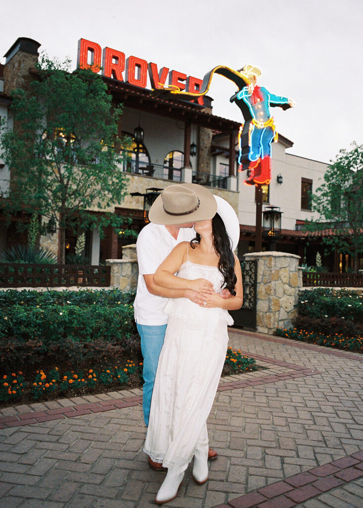 Playful couple laughing together during Fort Worth engagement photos