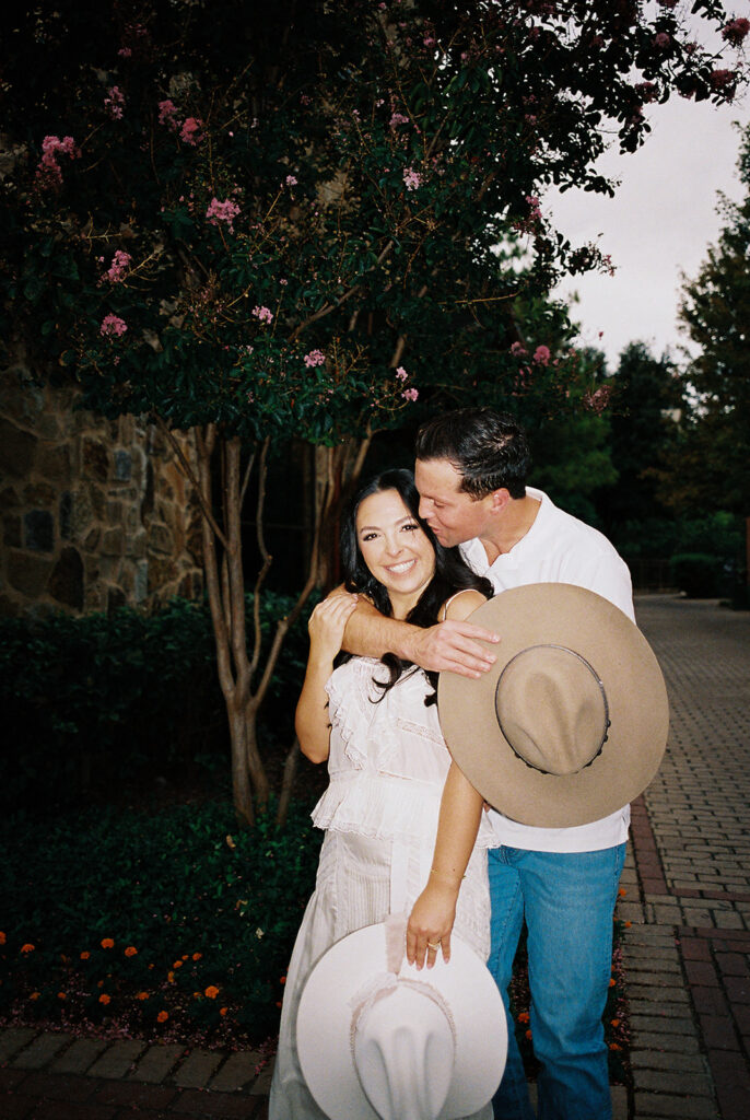 Romantic engagement portraits in golden hour light at Hotel Drover
