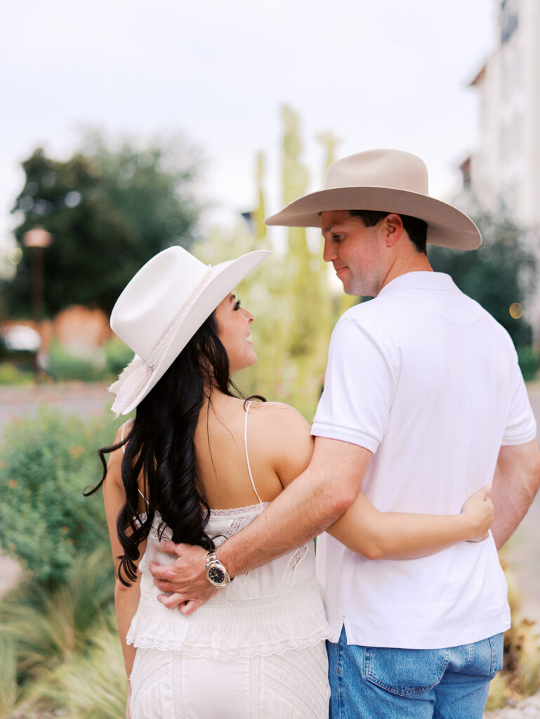Romantic engagement portraits in golden hour light at Hotel Drover