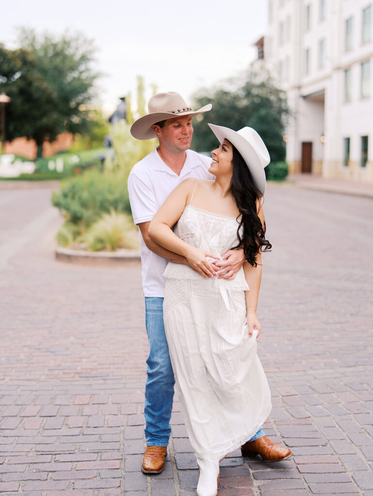 Romantic engagement portraits in golden hour light at Hotel Drover