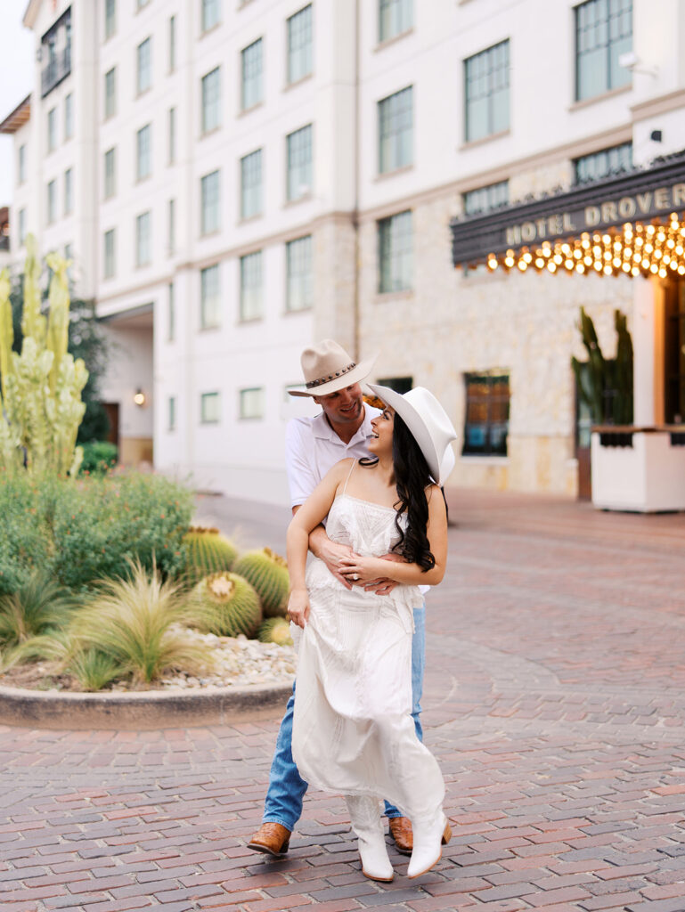 Romantic engagement portraits in golden hour light at Hotel Drover