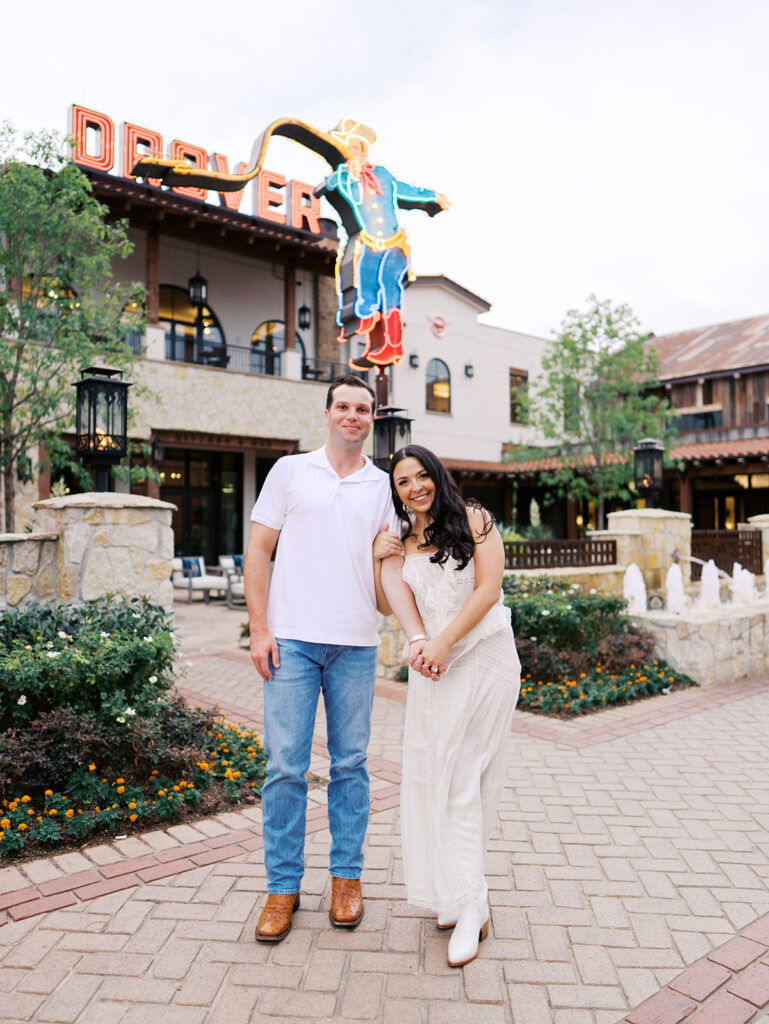 Playful couple laughing together during Fort Worth engagement photos
