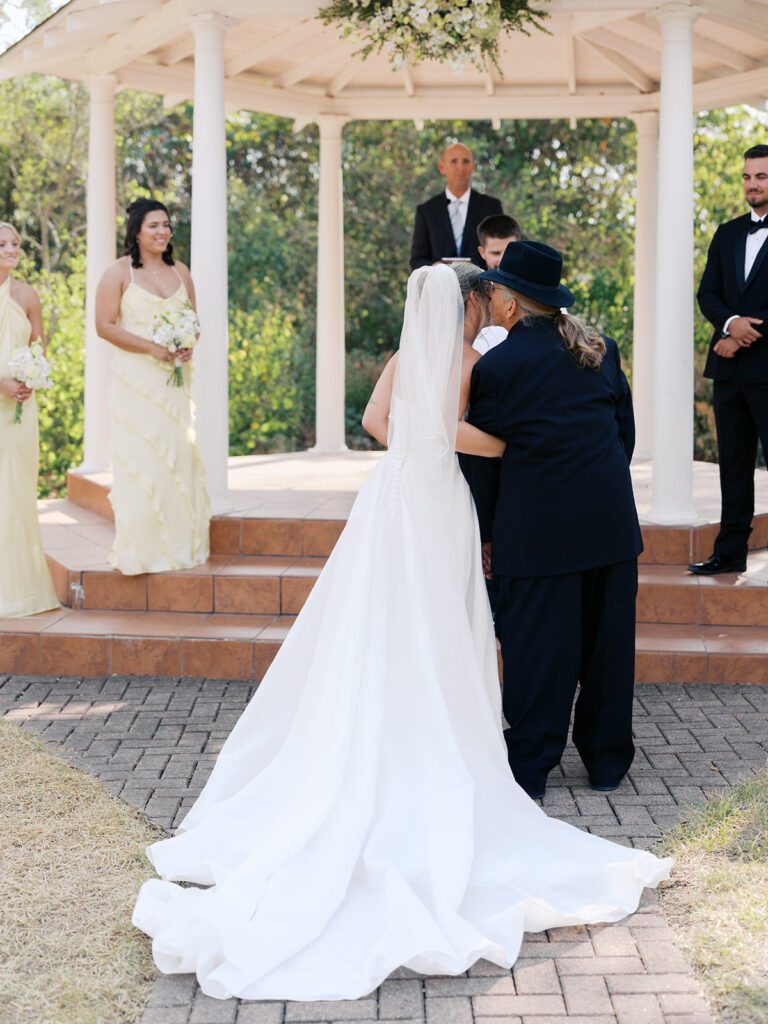Outdoor ceremony under oak trees at The Winfield Inn in Austin