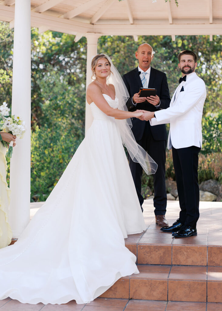 Outdoor ceremony under oak trees at The Winfield Inn in Austin