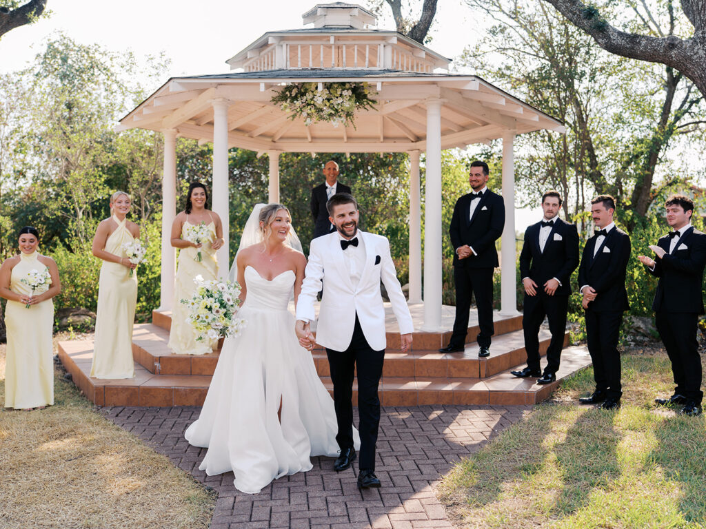Outdoor ceremony under oak trees at The Winfield Inn in Austin