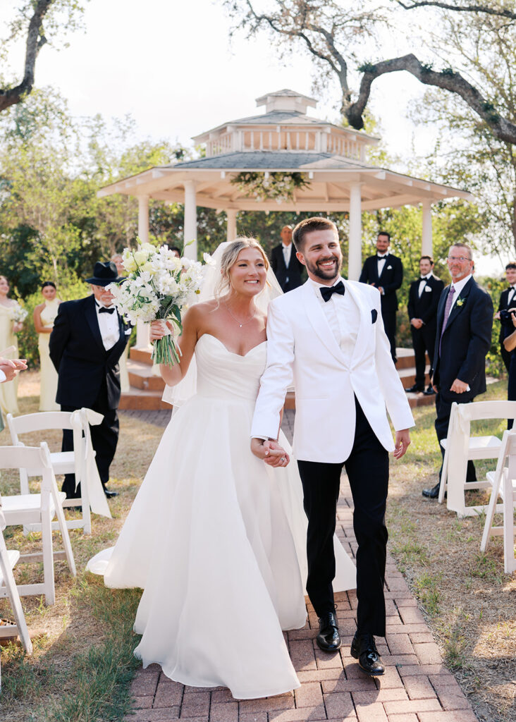 Outdoor ceremony under oak trees at The Winfield Inn in Austin