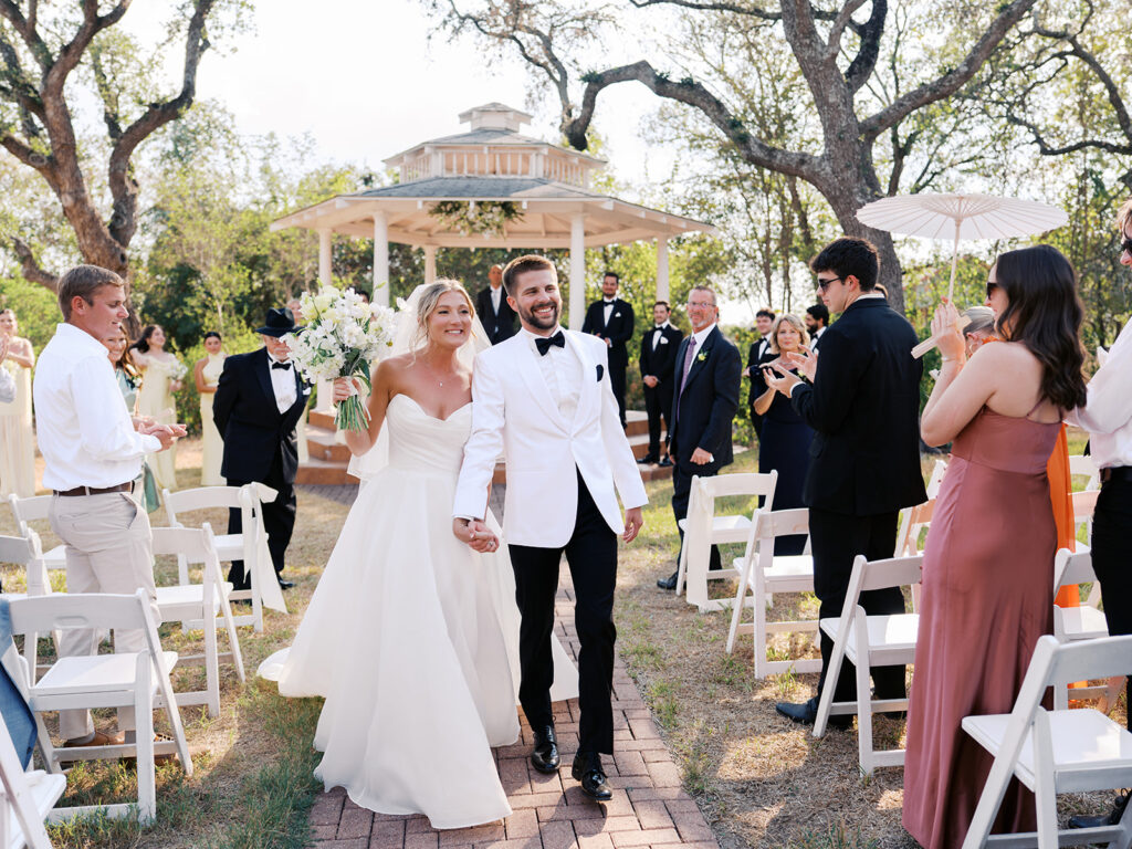Outdoor ceremony under oak trees at The Winfield Inn in Austin
