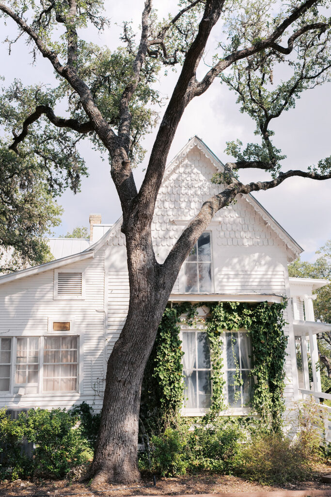 Joyful couple walking through garden at The Winfield Inn wedding