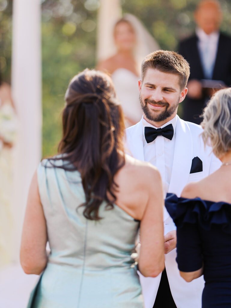 Joyful couple walking through garden at The Winfield Inn wedding
