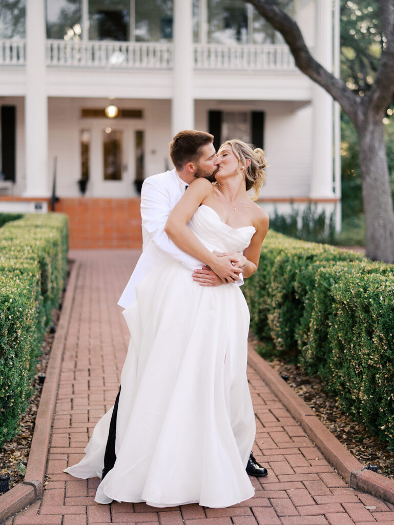 Outdoor ceremony under oak trees at The Winfield Inn in Austin