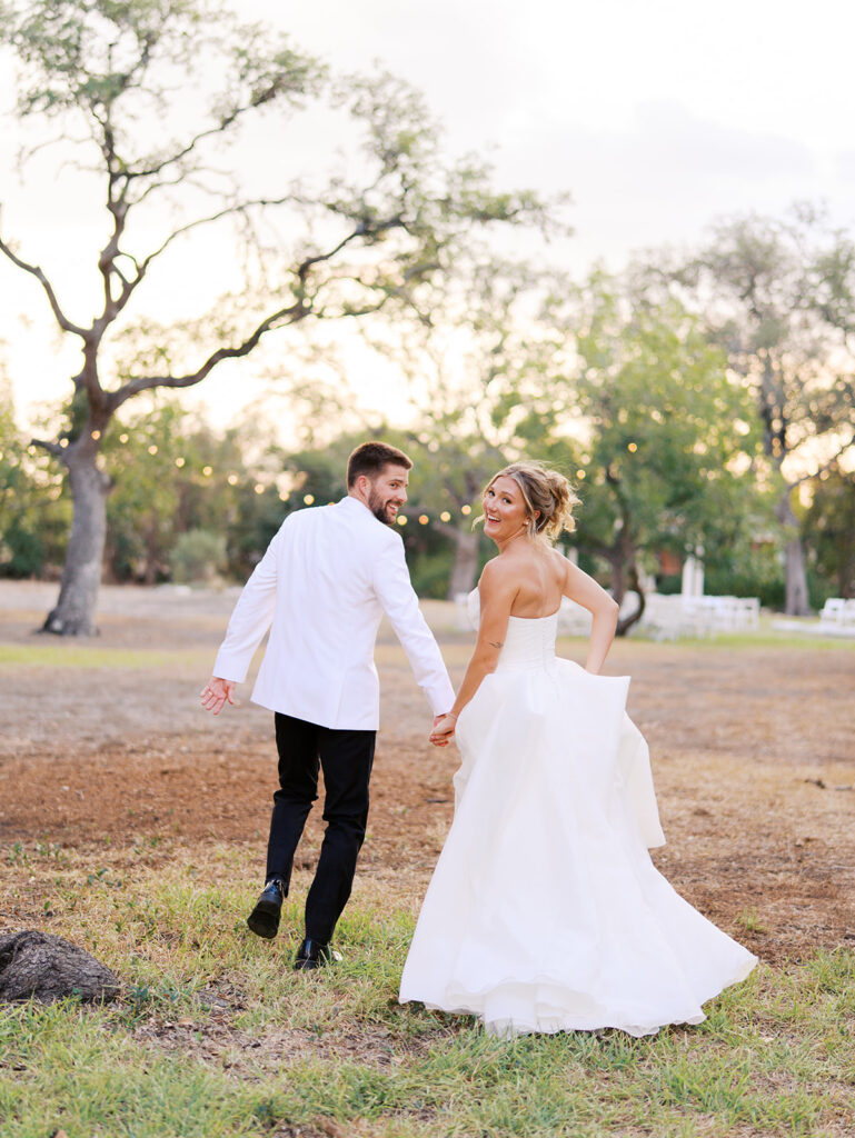 Outdoor ceremony under oak trees at The Winfield Inn in Austin