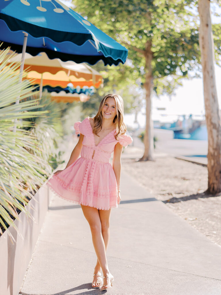 Austin senior photography session with golden sunlight and city views on South Congress